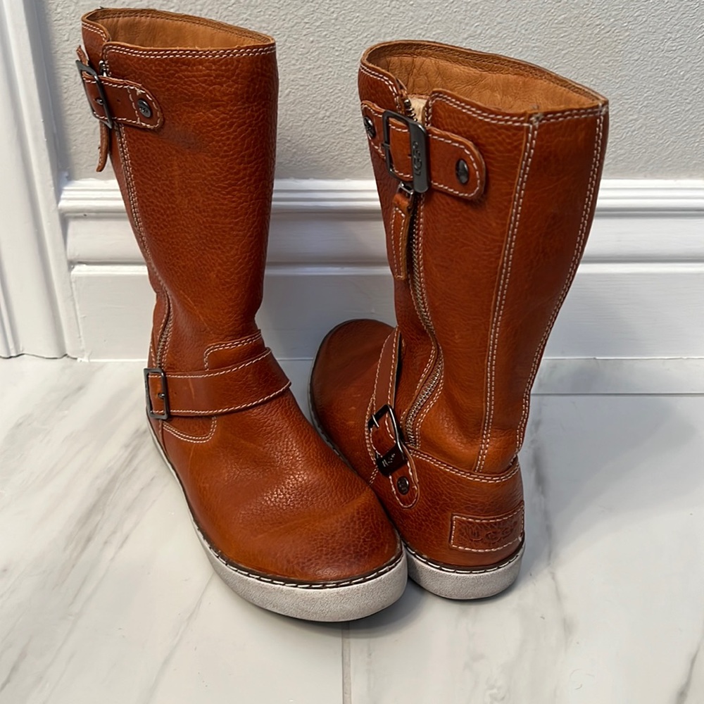Rare Ugg leather boots, lined for warmth. About calf high. Worn twice.